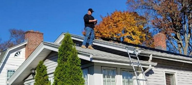 Jay McNulty, home inspector at JFM Home Inspections, performing a home maintenance inspection.
